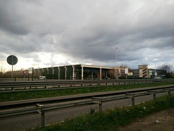 Bridge in city against sky