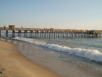 Scenic view of beach against clear sky