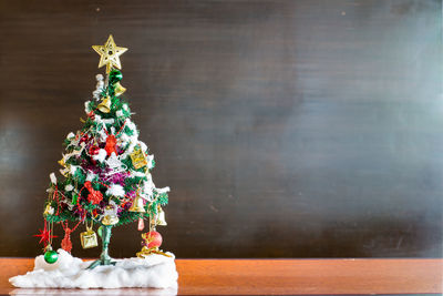 Christmas tree against wall