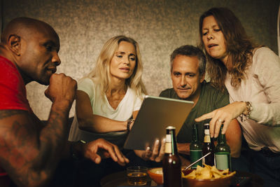 Friends sitting on table