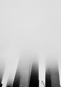 Low angle view of buildings in city against sky