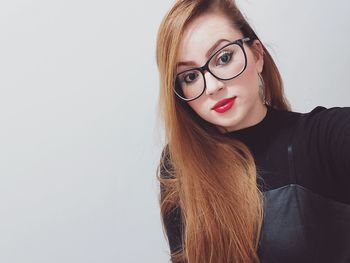 Portrait of young woman in eyeglasses