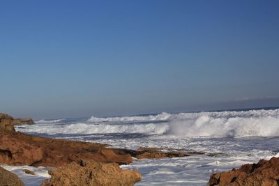 Scenic view of sea against clear sky