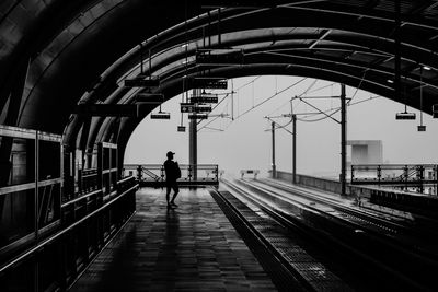 Man standing on railroad station