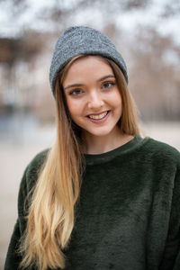 Portrait of smiling young woman in winter