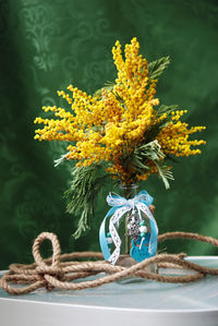 Close-up of flower vase on table