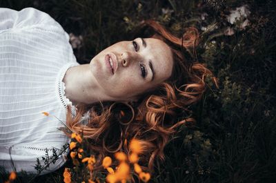 Portrait of young woman lying down