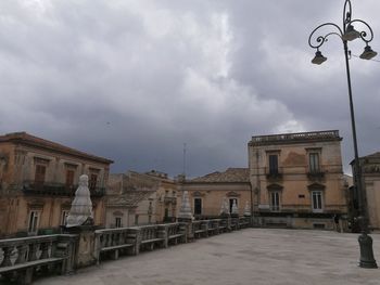 Buildings in city against sky