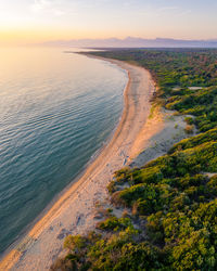 High angle view of beach against sky during sunset