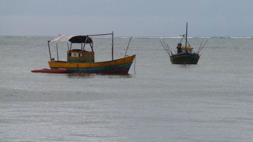 Ship in sea against sky