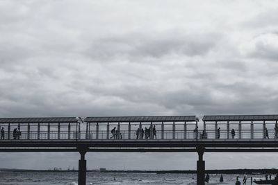 Bridge over sea against sky