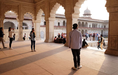 Group of people in front of historical building