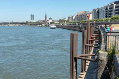 Bridge over river with buildings in background