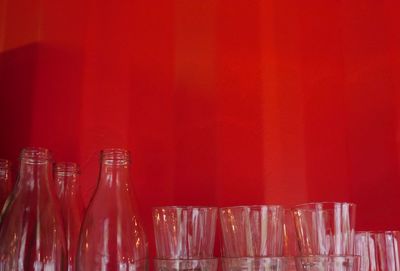 Close-up of red wine bottles on table