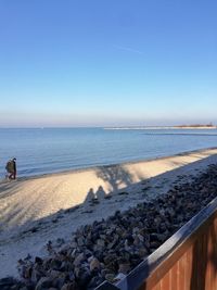 Scenic view of sea against clear blue sky