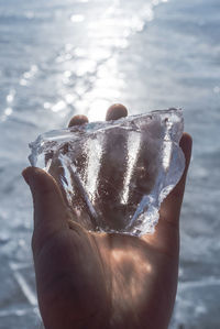 Close-up of hand holding ice cream