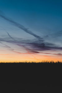 Silhouette landscape against sky during sunset