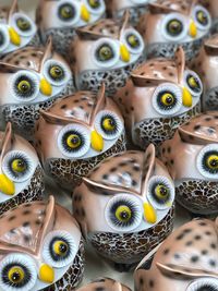 Full frame shot of owl figurines at store