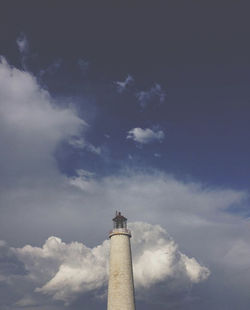 Low angle view of lighthouse against building