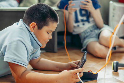 High angle view of boy playing with toy at home