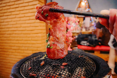 Close-up of meat on barbecue grill