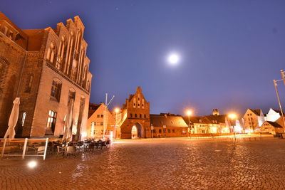 View of city buildings at night