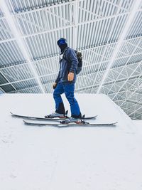 Low angle view of man skiing on snow