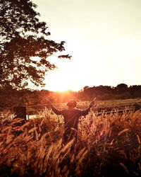 Scenic view of field against sky during sunset