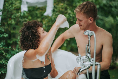 Young couple kissing in water