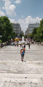People walking on street in city