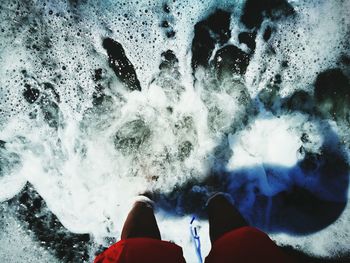 Low section of woman in water