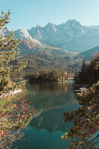 Scenic view of lake and mountains against sky