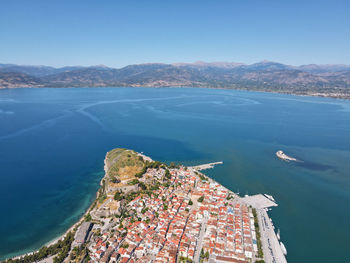 High angle view of sea and buildings against sky