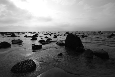 Scenic view of sea against cloudy sky