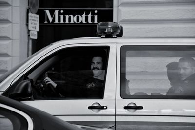 Reflection of woman on car window