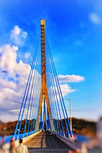 Low angle view of bridge against blue sky