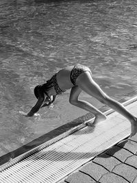 Girl diving in swimming pool