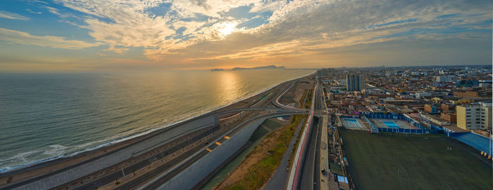 Panoramic night view of the costa verde trail at sunset, in san miguel - lima, peru.