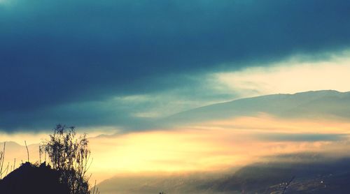 Scenic view of landscape against cloudy sky