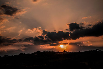 Scenic view of dramatic sky during sunset