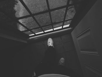 Woman standing in the dark