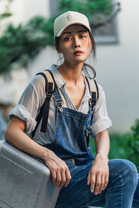 Portrait of young woman standing outdoors