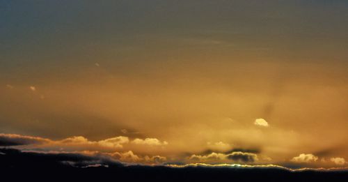 Scenic view of dramatic sky during sunset