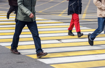 Low section of people crossing road