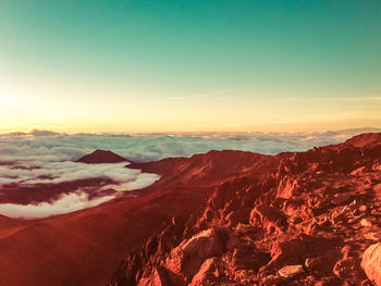 Scenic view of dramatic landscape during sunset