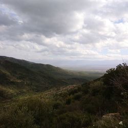 Scenic view of landscape against cloudy sky