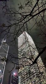 Low angle view of bare trees against sky