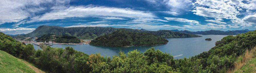 Panoramic view of lake and trees against sky