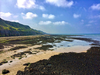 Scenic view of beach against sky