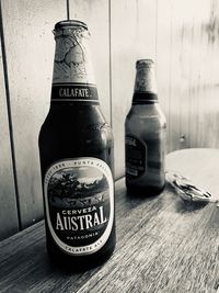 Close-up of beer bottles on table